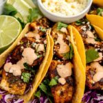 Enjoy fresh and flavorful Trout Tacos with flaked trout, vibrant cabbage slaw, avocado slices, and crumbled queso fresco, perfect for a light and healthy meal