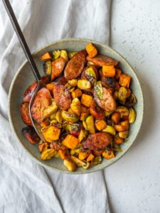 Try this easy Chicken Apple Sausage Sheet Pan Dinner! Packed with sweet potatoes, veggies, and flavorful sausage, it’s a healthy, one-pan meal perfect for busy nights