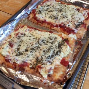 Discover a delicious twist on lasagna with this easy Lasagna Flatbread recipe, featuring layers of meat sauce and creamy cheese in warm flatbread