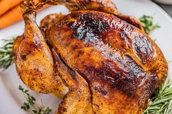 Discover the secrets to a mouthwatering Juicy Roasted Chicken with crispy skin and tender meat, infused with herbs and lemon for unbeatable flavor!