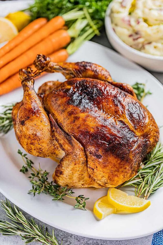 Discover the secrets to a mouthwatering Juicy Roasted Chicken with crispy skin and tender meat, infused with herbs and lemon for unbeatable flavor!