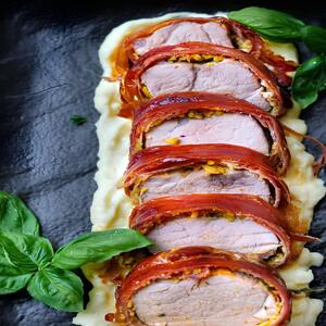 Discover a succulent Prosciutto-Wrapped Pork Tenderloin, infused with crispy sage and garlic for a flavorful, elegant dish perfect for any occasion