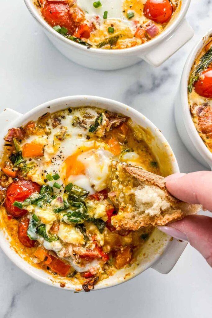 Whip up savory Baked Feta Eggs in just 15 minutes! Tangy feta, fresh veggies, and perfectly baked eggs create a delicious, quick breakfast or brunch dish