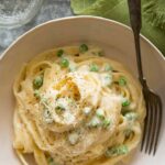 Discover the creamiest Fettuccine Alfredo recipe that's easy to make at home. Rich, garlicky sauce and tender pasta combine for an indulgent meal you'll love
