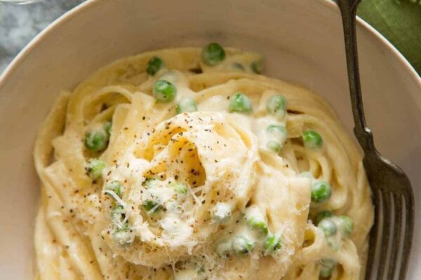 Discover the creamiest Fettuccine Alfredo recipe that's easy to make at home. Rich, garlicky sauce and tender pasta combine for an indulgent meal you'll love