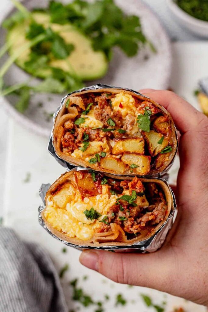 "Learn how to cook a delicious Breakfast Burrito filled with crispy potatoes, zesty chorizo, and scrambled eggs. Perfect for a hearty morning meal!"