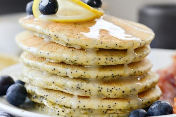 Learn how to cook fluffy Lemon Poppy Seed Pancakes with zesty lemon flavor and poppy seeds, drizzled in homemade syrup for a delightful breakfast treat