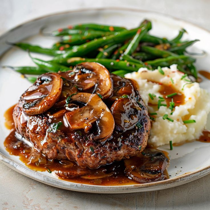 "Irresistible Salisbury Steak: A Comforting Classic with Savory Mushroom Gravy"